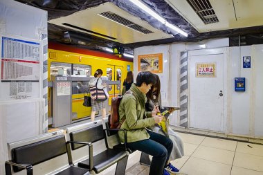 People Traveling By Using Tokyo Subway or Metro Lines for Transportation