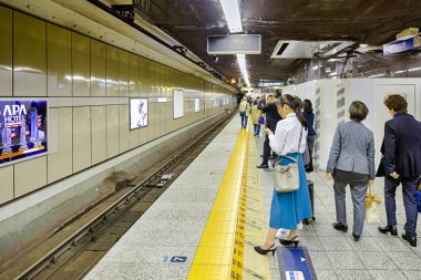 People Traveling In Tokyo Subway or Metro Lines in Tokyo City