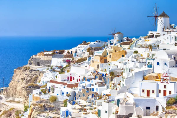 Greece Traveling. View of Greek Traditional Colorful Houses and Windmills of Oia or Ia at Santorini Island in Greece at Noon. Horizontal Image Orientation