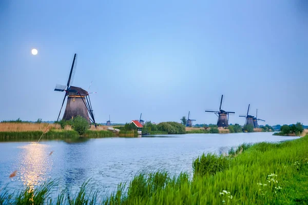 European Destinations. Traditional Romantic Dutch Windmills in Kinderdijk Village in the Netherlands. Horizontal Shot