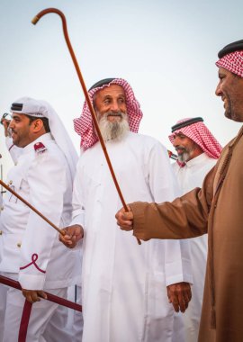 Adam 12 Eylül 2014 'te Al Dafrah festivalinde geleneksel bir Yawalah dansı gerçekleştirdi.