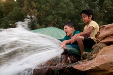 Children playing in Green Mubazzarah Chalets, Al Ain, Abu Dhabi in 28/02/2014