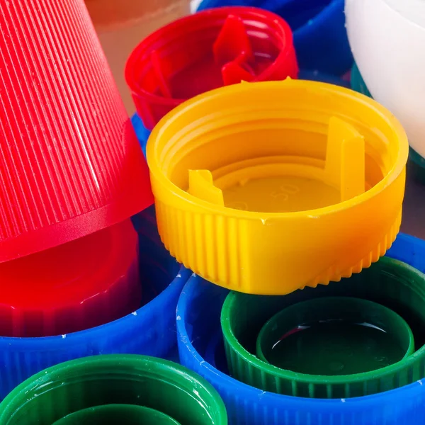 Colored plastic bottle caps.