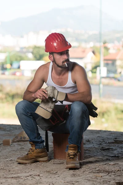 Lazy Man เกี่ยวกับการก่อสร้าง — ภาพถ่ายสต็อก