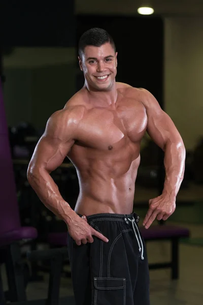 Healthy Young Man Flexing Muscles — Stock Photo, Image