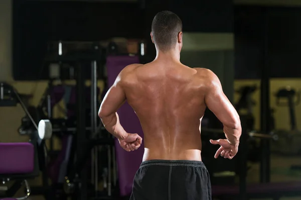 Young Bodybuilder Flexing Rear Double Biceps Pose — Stock Photo, Image