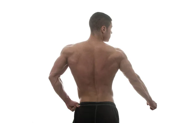 Muskulöse Bodybuilder Kerl posiert über weißem Hintergrund — Stockfoto
