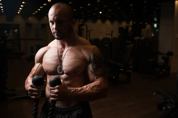 Man Doing Exercise For Biceps On Cable Machine — Stock Photo, Image