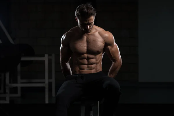 Attractive Young Man Resting In Gym Afther Exercise — Stock Photo, Image