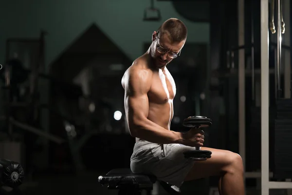 Geek Man With Dumbbell Exercising Biceps — Stock Photo, Image