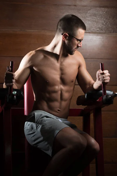 Handsome Man Performing Hanging Leg Raises Exercise — Stock Photo, Image