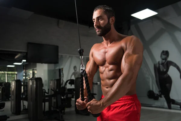 Bodybuilder Doing Heavy Weight Exercise For Triceps With Cable — Stock Photo, Image