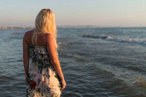 Posing At Tropical Beach With Clear Blue Water