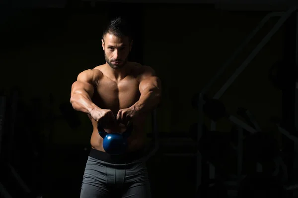 Young Man Exercising With Kettle Bell — Stock Photo, Image