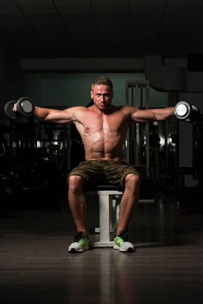 Shoulder Exercise With Dumbbells In Dark Room — Stock Photo, Image