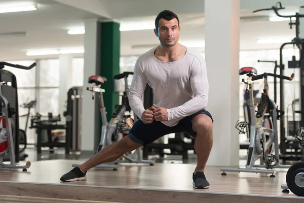 Healthy Man Stretches At The Floor — Stock Photo, Image