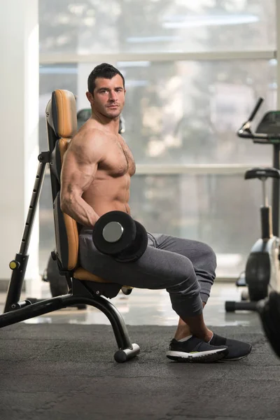 Biceps Exercise With Dumbbell in a Fitness Center — Stock Photo, Image