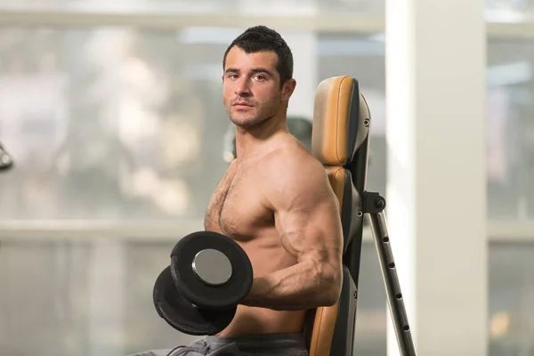 Biceps Exercise With Dumbbell in a Gym — Stock Photo, Image