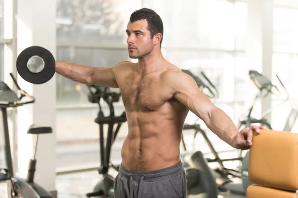 Hairy Man With Dumbbells Exercising Shoulders — Stock Photo, Image