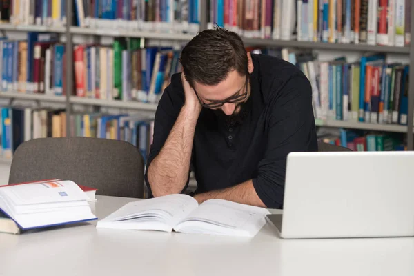 Young Student Using His Laptop In A Library — Stock Photo, Image