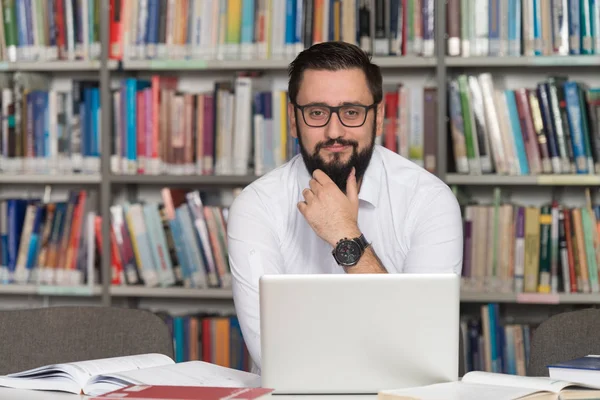 Happy Male Student With Laptop In Library — Stock Photo, Image