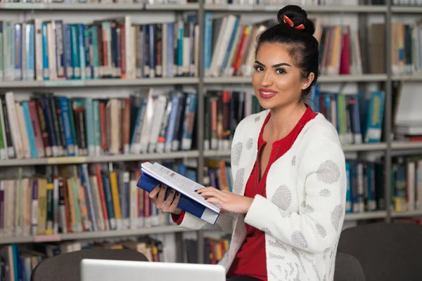 Happy Female Student Working With Laptop In Library — Stock Photo, Image