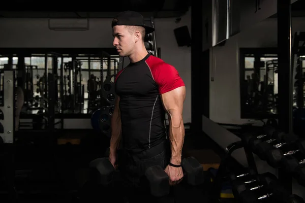 Muscular Man Exercising Biceps With Dumbbell — Stock Photo, Image