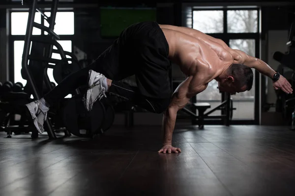 Athlete Doing Extreme Handstand In Gym — Stock Photo, Image