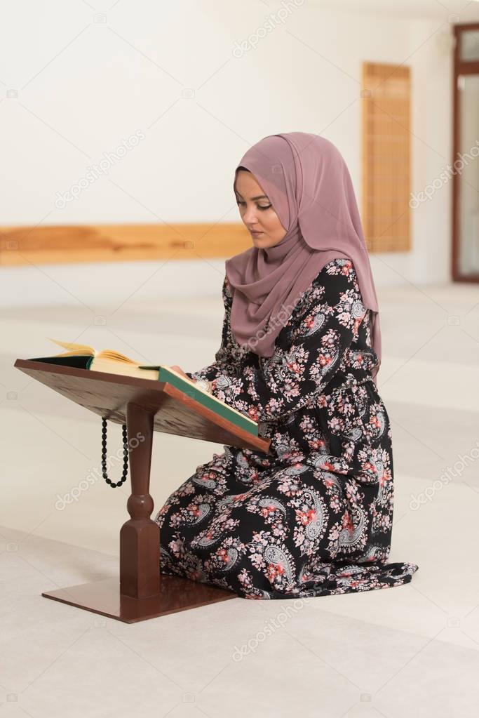 Muslim Woman Is Reading The Koran