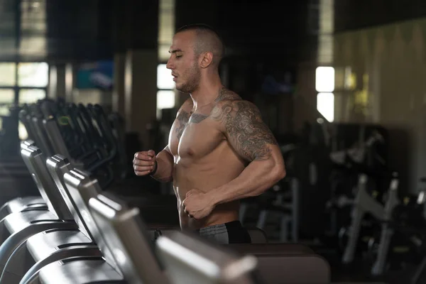 Fitness Man Running On Treadmill — Stock Photo, Image