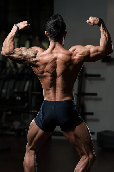 Bodybuilder Fitness Model Posing Double Biceps After Exercises — Stock Photo, Image