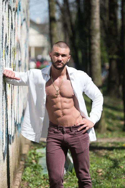 Strong Man in White T-shirt Background Park