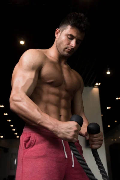 Man Exercising Biceps On Machine — Stock Photo, Image