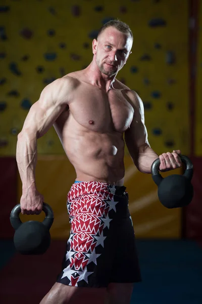 Man Exercising With Kettle Bell — Stock Photo, Image