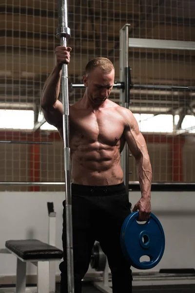 Man Flexing Muscles With Barbell and Weights — Stock Photo, Image