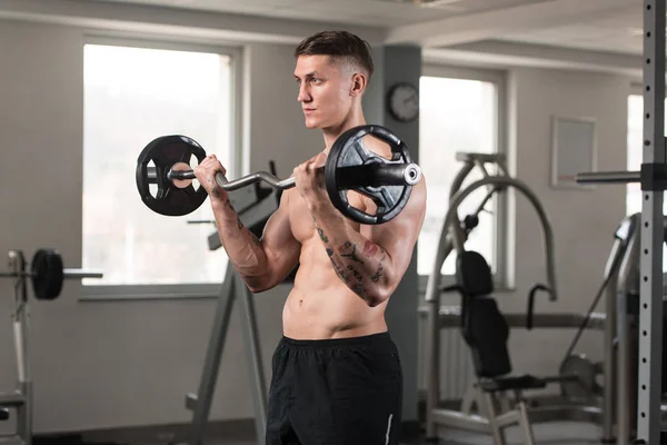 Muscular Young Man Exercising Biceps With Barbell — Stock Photo, Image