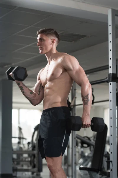 Young Man With Dumbbells Exercising Biceps — Stock Photo, Image