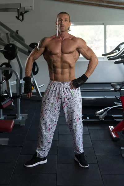 Handsome Man Flexing Muscles — Stock Photo, Image