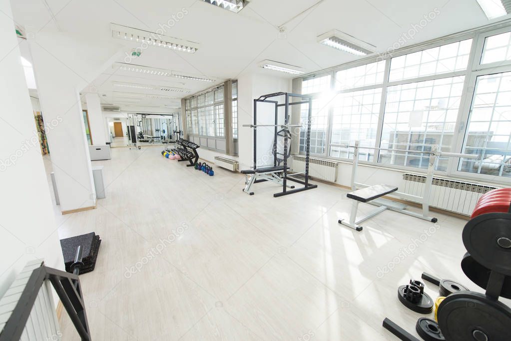 Modern Gym Room Fitness Center With Equipment And Machines