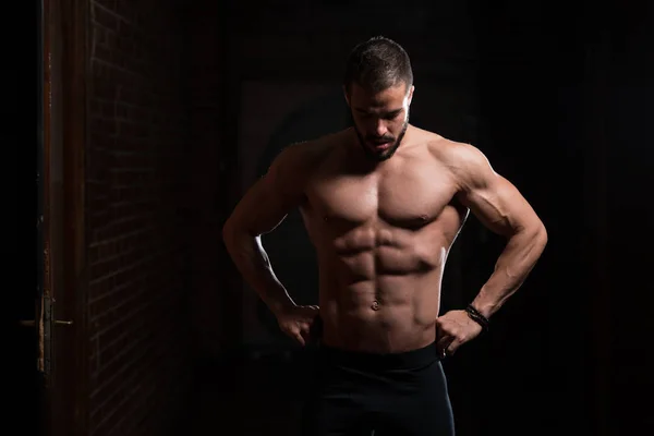 Handsome Model Flexing Muscles — Stock Photo, Image