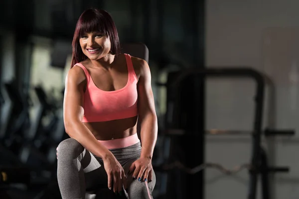Woman Resting On Bench In Fitness Center — Stock Photo, Image