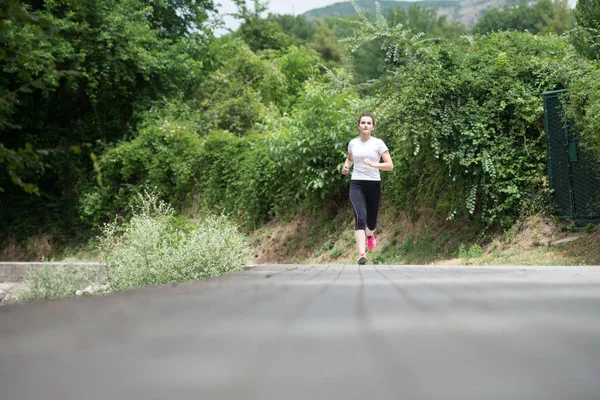 Beautiful Fit Girl Running Outdoors