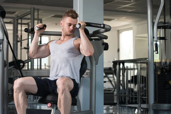 Young Man Exercising Biceps In The Gym — Stock Photo, Image