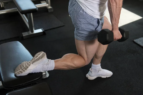 Woman Exercising Hamstrings With Dumbbells — Stock Photo, Image