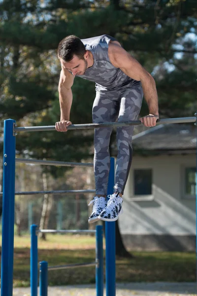 Sports Man Training With With Dips Bar — Stock Photo, Image