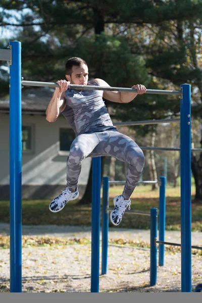 Young Athlete Exercising With Dips Bar — Stock Photo, Image