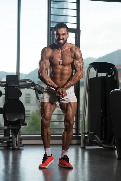 Serious Bodybuilder Standing in the Gym — Stock Photo, Image