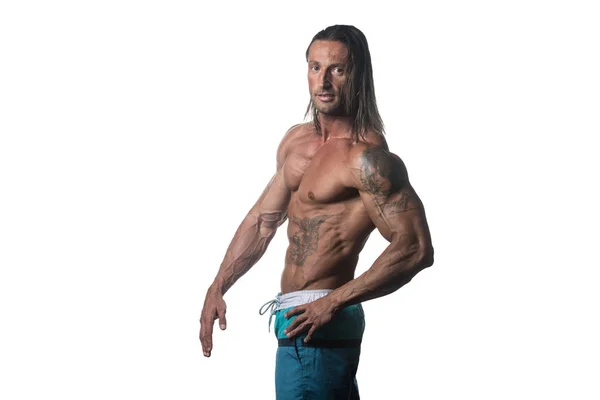 Muskuløs bodybuilder Guy Posing Over White Baggrund - Stock-foto