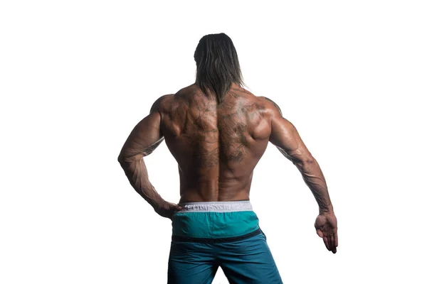 Beyaz arka plan üzerinde poz kaslı vücut geliştirmeci adam — Stok fotoğraf