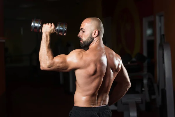 Bodybuilder Exercising Shoulders With Dumbbell — Stock Photo, Image